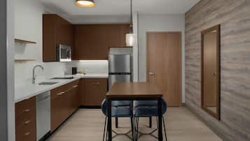 Premium bedding, desk, laptop workspace, blackout drapes