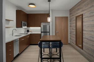 Premium bedding, desk, laptop workspace, blackout drapes