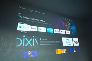 A digital interface with a movie title, a Play Store icon, and various app icons. - KAMI SUITES (Osaka)