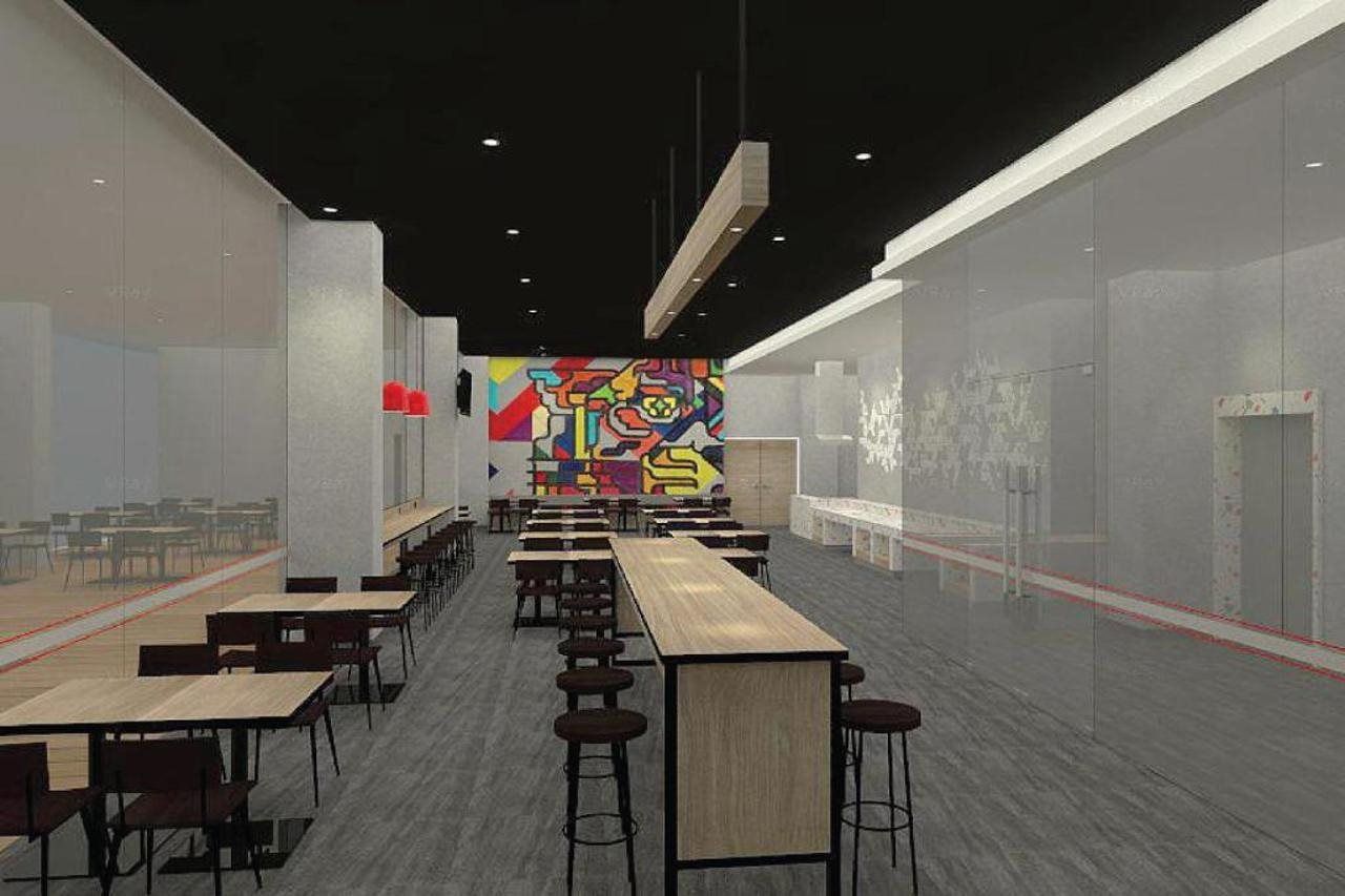 A modern interior with long tables and chairs, a colorful mural, and a glass partition.