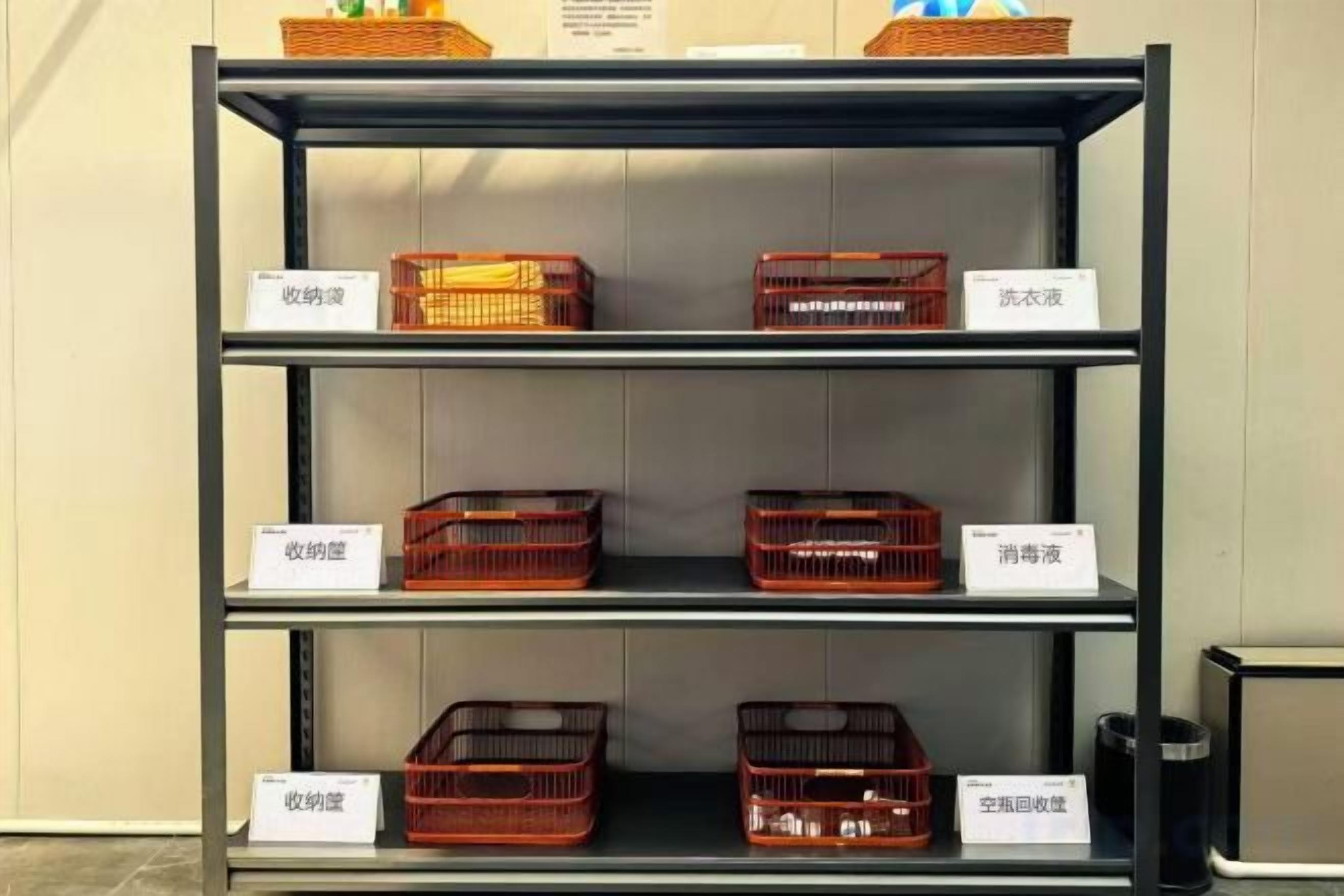 A metal shelving unit with labeled baskets.