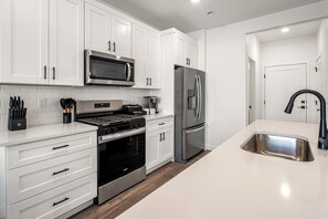 Fridge, microwave, dishwasher, coffee/tea maker