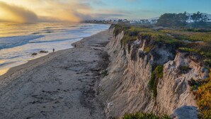 A coastal landscape with a sandy beach, cliffs, and sparse vegetation. - NEW Rustic Villa – 2BD, 2BA Close to Beach and Everything! (Santa Barbara)