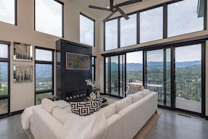TV, fireplace, books - Experience luxury in this spacious 6-bedroom, 6-bathroom townhome with stunning mountain views. (Durango)