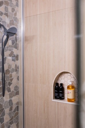 Shower, hair dryer, towels, soap
