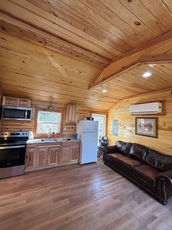 Living area. Charming cabin in St. Charles, AR just 600 yards from the boat ramp