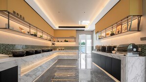 A modern kitchen with marble countertops, a central island, and a view of the outdoors. - MisooHi Hidden Realm Hotel (Huangshan)