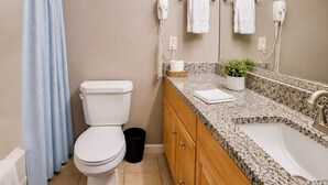 A bathroom with a toilet, sink, and towel rack. - Playhouse SQ Downtown, R&R Hall, Clinic, CSU (Cleveland)