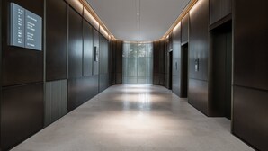 A modern elevator lobby with a polished floor and vertical light strips. - IntercityHotel Shenzhen Futian Huanggang (Shenzhen)