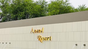A sign for "Anand Resort" with a pool and water features. - Anand Resort (Durg)
