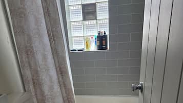 Shower, towels, soap, toilet paper