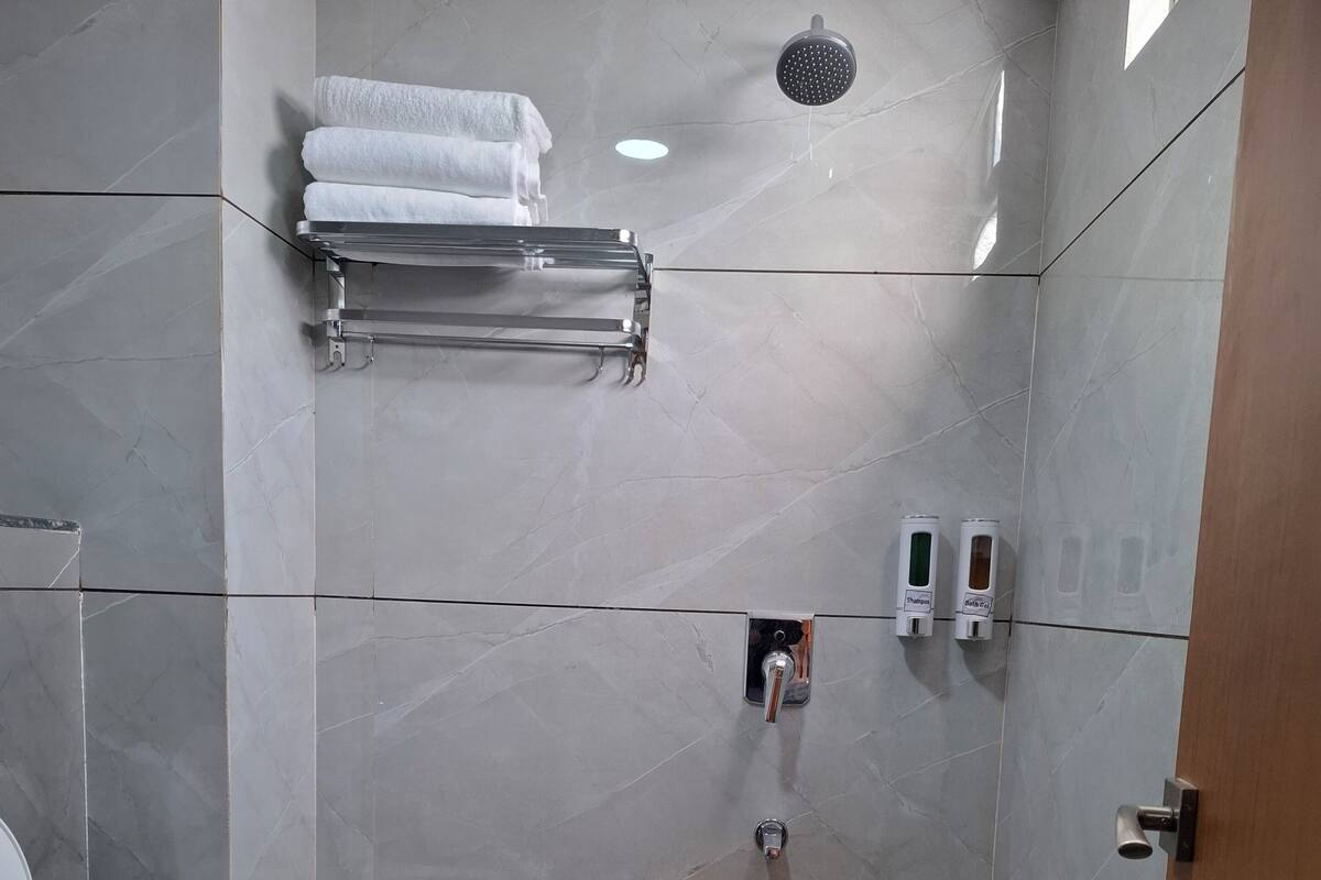 2 BHK Areca | Bathroom | Shower, rainfall showerhead, bidet, towels