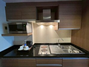 Triple Room | Private kitchen | Full-size fridge, microwave