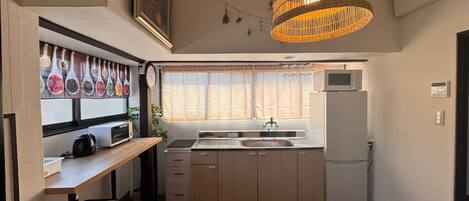 Fridge, microwave, cookware/dishes/utensils