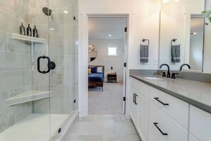 Shower, hair dryer, towels, shampoo