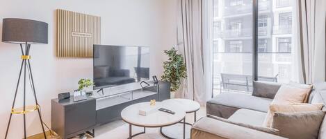 Apartment, Balcony, City View | Living area | 55-inch Smart TV with digital channels