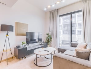 Apartment, Balcony, City View | Living area | 55-inch Smart TV with digital channels