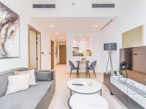 Apartment, Balcony, City View | Living area | 55-inch Smart TV with digital channels