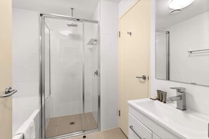 Shower, hair dryer, towels, shampoo