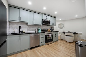 Fridge, microwave, cookware/dishes/utensils