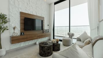 Deluxe Apartment, 2 Bedrooms, Private Pool, City View | Living area | 55-inch Smart TV with digital channels