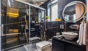 A modern bathroom with a glass shower enclosure, a sink, and a mirror. - Hotel Bawa Gurgaon, Medanta (Gurugram)