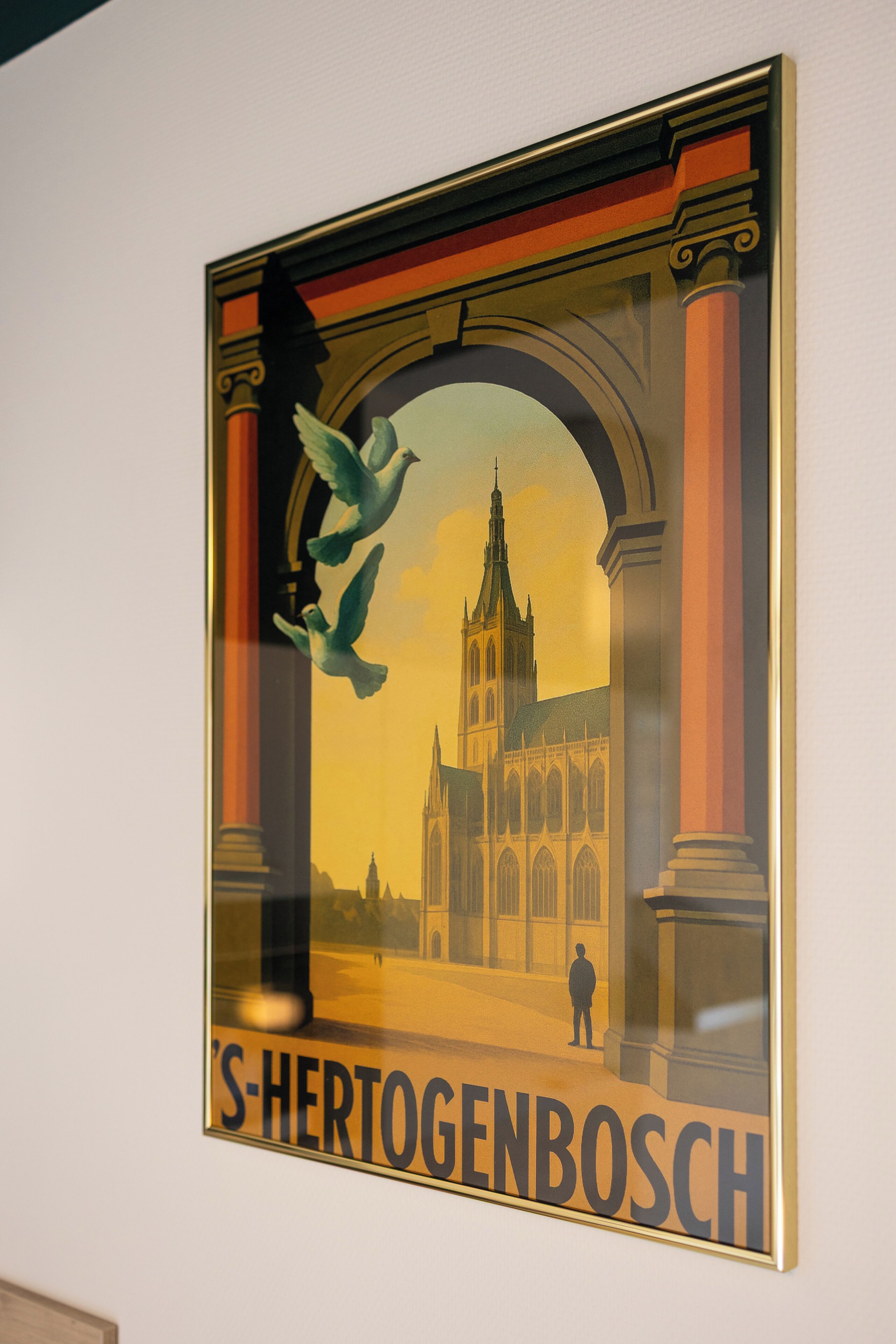 A framed poster with architectural elements and the text "S-HERTOGENBOSCH".