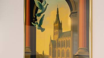 A framed poster with architectural elements and the text "S-HERTOGENBOSCH".
