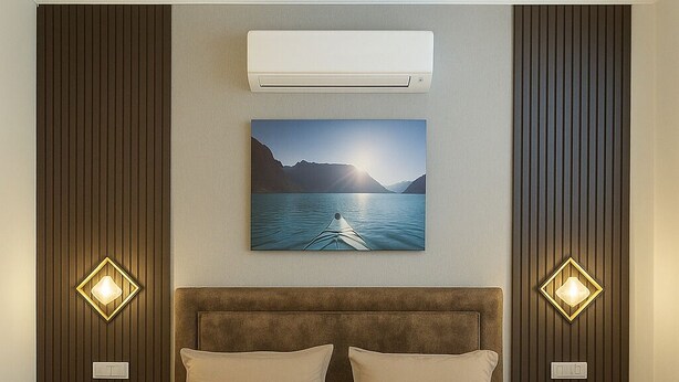 A modern bedroom with a large bed, wooden headboard, and a ceiling fan. - Let'stay- Aerocity Mohali  (Mohali)