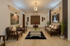 Basic Apartment, Balcony, City View | Living area | 32-inch LCD TV with cable channels