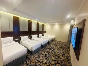 Quarto família | Frigobar, cofres nos quartos, quartos à prova de som, Wi-Fi de cortesia