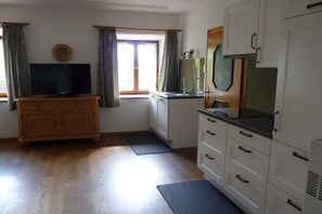 Fridge, stovetop, dishwasher, coffee/tea maker