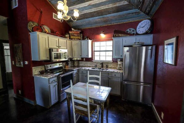 Fridge, microwave, stovetop, coffee/tea maker