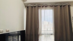 Room, 1 Bedroom, Balcony, City View | Living room - Room-serene Getaway With Prime Emperador (Iloilo)