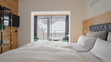 Classic Suite, 2 Bedrooms, Balcony | In-room safe, desk, laptop workspace, iron/ironing board