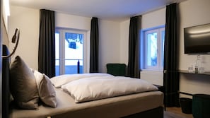 Classic Suite, 2 Bedrooms, Balcony | In-room safe, desk, laptop workspace, iron/ironing board
