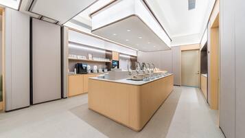A modern kitchen with a central island, built-in appliances, and a sleek design.