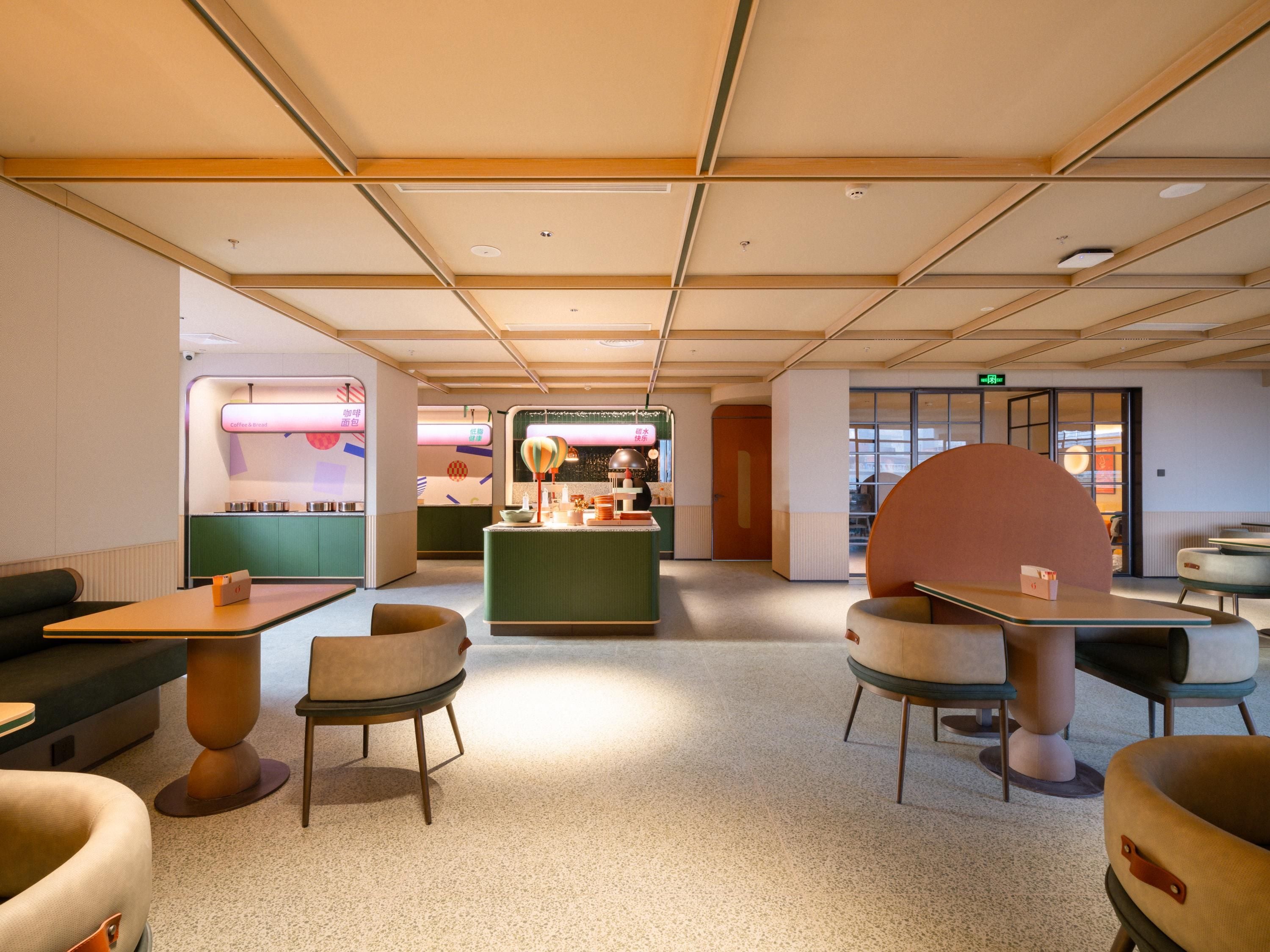 A modern interior with seating areas, a central counter, and a visible exit door.