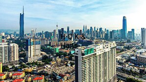 A cityscape with high-rise buildings and a prominent tower. - KL City View at Trion 2 by HCK (Kuala Lumpur)