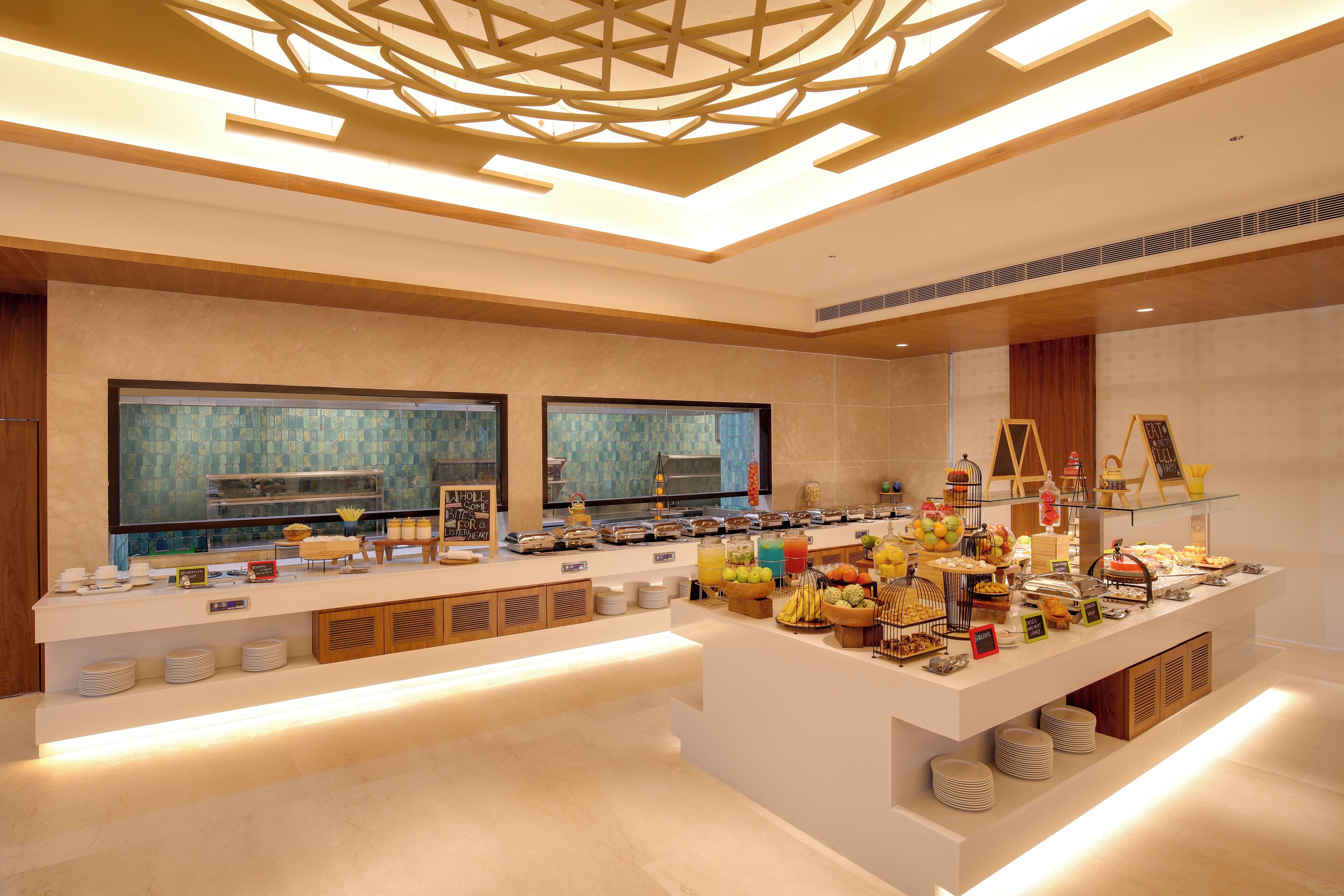 A modern breakfast buffet with a variety of food items and a contemporary interior design.