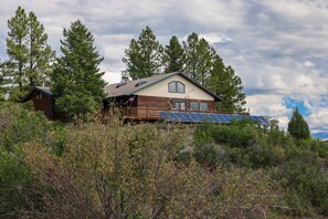 Exterior - Retro-Modern, Mountain Retreat with 3 bedrooms, 2 baths, a bonus game room, office, and a beautiful deck with ample seating for enjoying the Stunning Mountain Peak Views. Best Views in town. (Pagosa Springs)