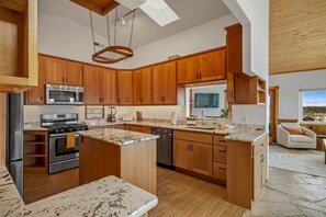 Coffee/tea maker, fridge, microwave, oven - Retro-Modern, Mountain Retreat with 3 bedrooms, 2 baths, a bonus game room, office, and a beautiful deck with ample seating for enjoying the Stunning Mountain Peak Views. Best Views in town. (Pagosa Springs)