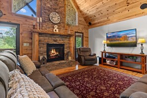 Smart TV, fireplace, books, stereo