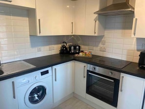 Fridge, oven, toaster, cookware/dishes/utensils