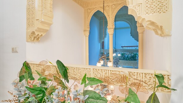 An ornate interior with detailed arches and a balcony with lush plants. - Holiday Home 'Casa Ramos Con Jacuzzi' with Sea View, Wi-Fi and Air Conditioning (Nerja)