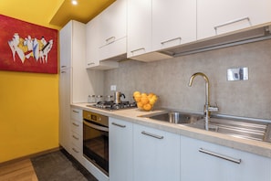 Studio, 1 Double Bed, Courtyard Area | Private kitchen | Fridge, oven, stovetop, cookware/dishes/utensils