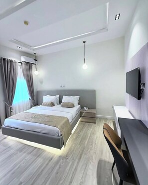 Deluxe Apartment, Balcony, City View | Desk, laptop workspace, blackout drapes, soundproofing