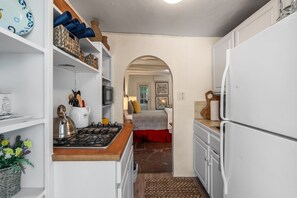 Fridge, microwave, coffee/tea maker, cookware/dishes/utensils