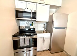 Fridge, microwave, stovetop, coffee/tea maker