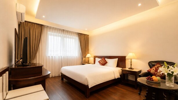 A hotel room with a bed, bedside tables, a desk, a chair, a TV, and a window with curtains. - S79 Khai Ngoc Hotel Dalat (Xuan Huong - Da Lat)